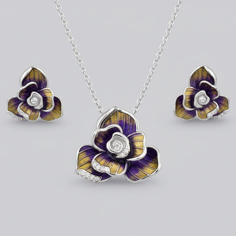 Floral jewelry set with necklace and earrings on a light blue background