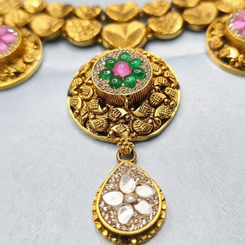 Golden jewellery set with Pink and Green Stones