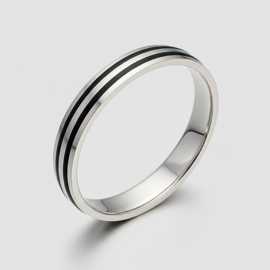 Silver ring with black stripe on a light gray background