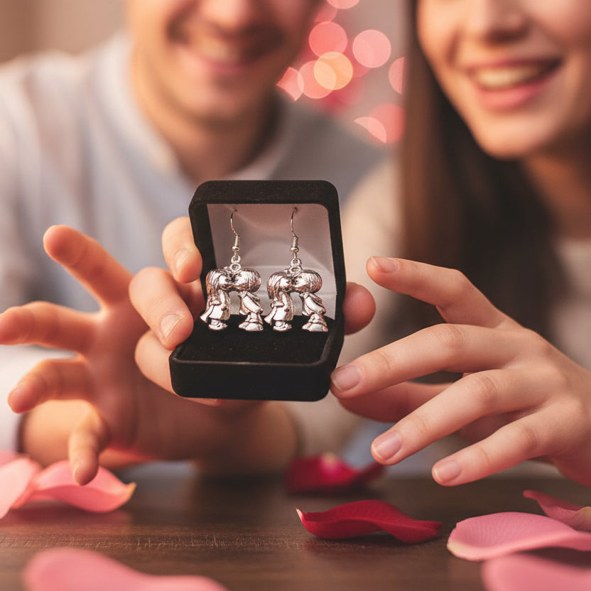 Boy girl kiss earring