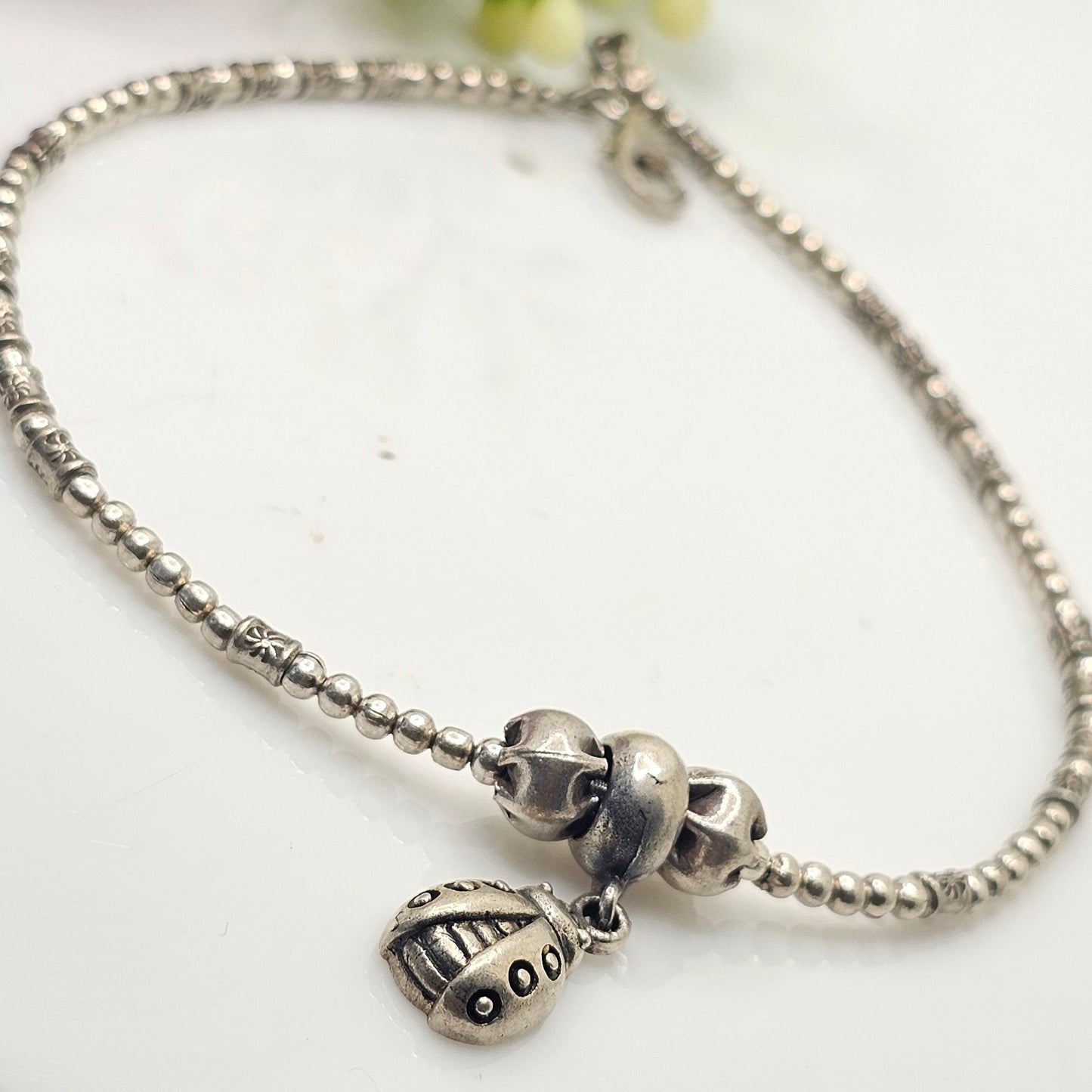 silver beads and beetel charm anklet
