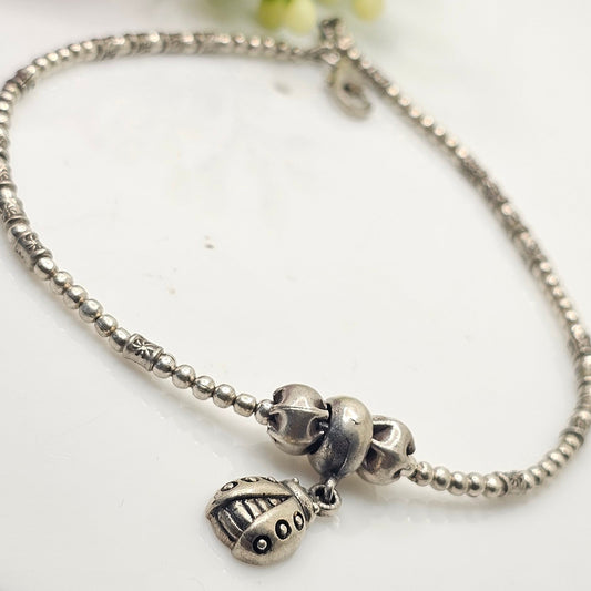 silver beads and beetel charm anklet